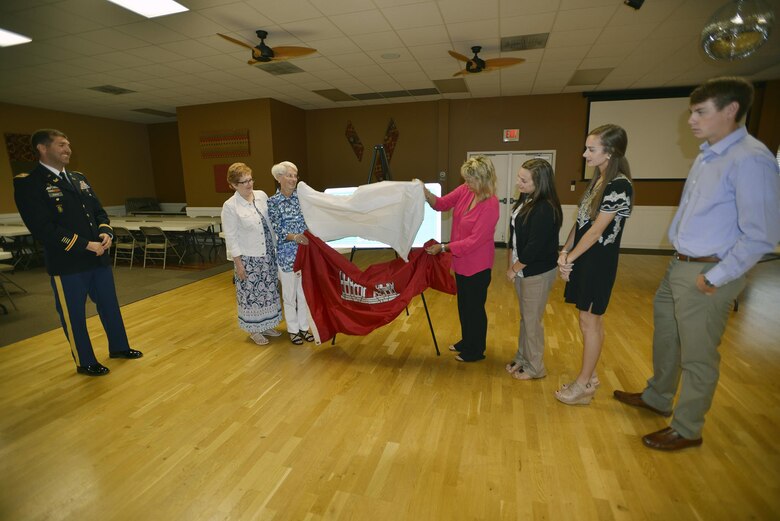 The family of Tony Ellisi unveils a new sign bearing his name. The US Highway 62 Bridge across the Tennessee River below Kentucky Dam was re-named in memory and in honor of former U.S. Army Corps of Engineers Kentucky Lock resident engineer George A. (Tony) Ellis May 30, 2017. (Photo by Mark Rankin)