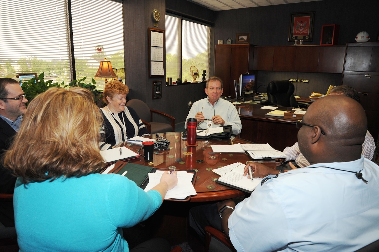 Albert "Chip" Marin III, U.S. Army Engineering and Support Center, Huntsville's new programs director, speaks to his team during a recent director's meeting.