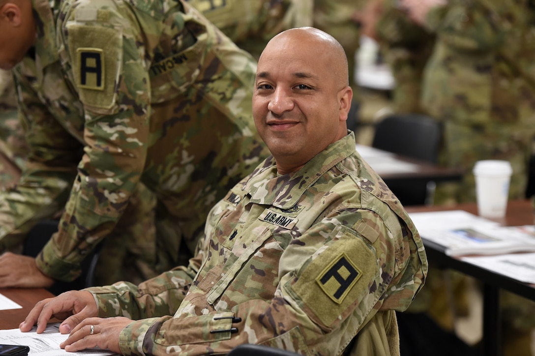 Army Reserve Lt. Col. Augusto Villalazhiguero, Commander, 2nd Battalion, 345th Regiment, Fort Jackson, South Carolina, pauses for a photo during the 85th Support Command’s New Command Teams Orientation brief in Arlington Heights, Ill. on May 19-20, 2017. Villalazhiguero said having the opportunity to hear exactly how the unique partnership between the 85th SPT CMD and First Army works from the leadership is incredibly useful. 
(U.S. Army photo by Sgt. Aaron Berogan/Released)