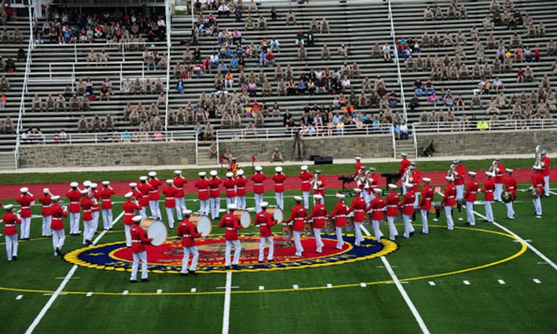 The Marine Corps Drum and Bugle Corps — “The Commandant’s Own” — perform on Butler Stadium’s brand new, artificial-turf field as the crowd at the stadium rededication ceremony looks on from the newly renovated bleachers in May 2012.