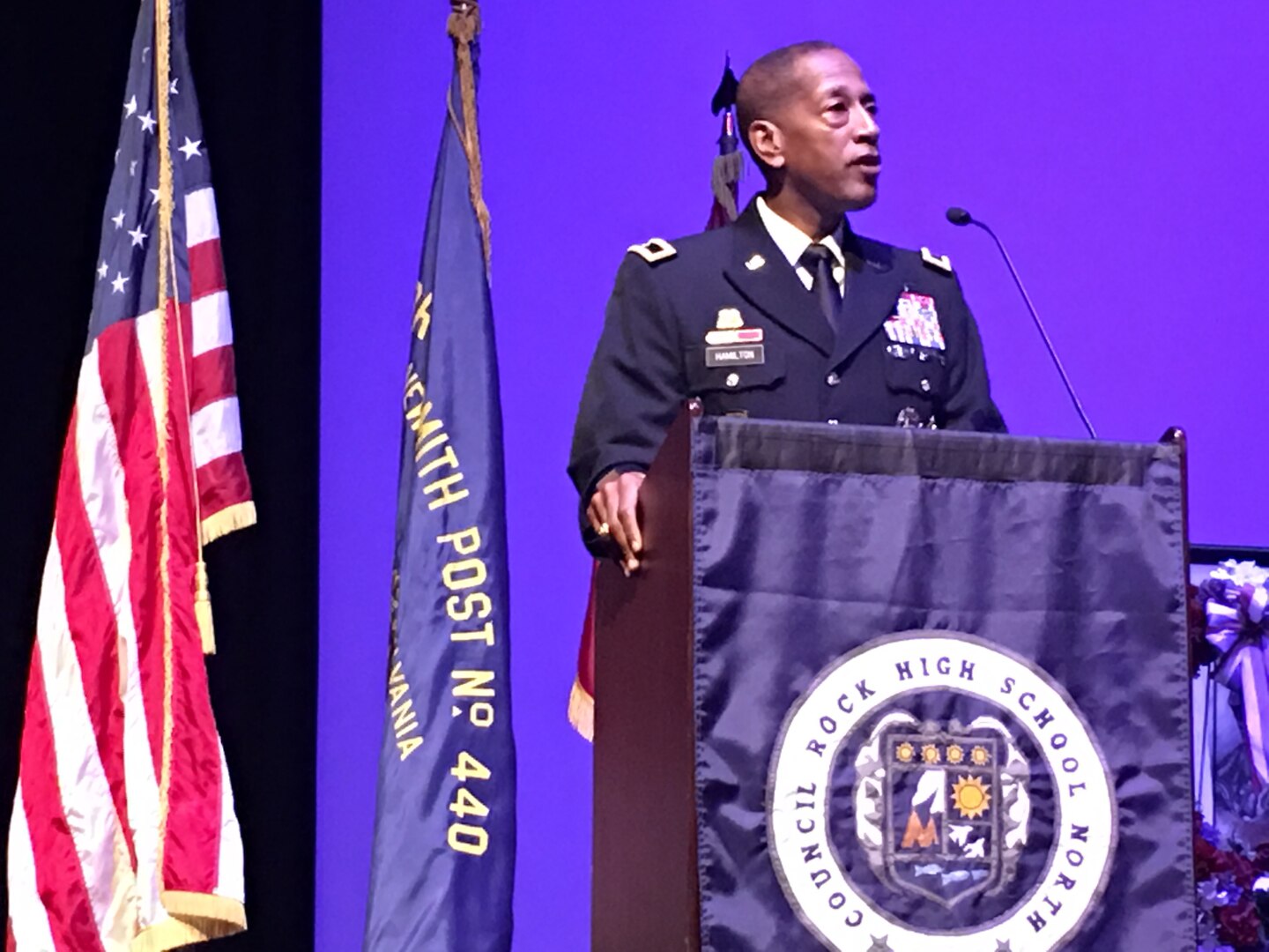 DLA Troop Support Commander Army Brig. Gen. Charles Hamilton speaks to junior and senior high school students at Council Rock North High School in Newtown, Pennsylvania, during a Memorial Day ceremony May 26. The ceremony paid tribute to the school’s 15 graduates who lost their lives in U.S. armed conflicts, along with all of America’s fallen service members. 