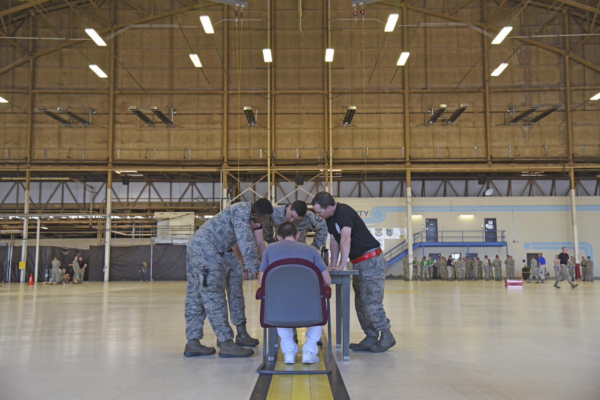 Team Raptor completes the final phase of the 2017 Spring Maintenance Olympics May 26, 2017, at Fairchild Air Force Base. The relay race included various maintenance tasks such as checking a toolbox for quality assurance fails, retrieving a streamer from a fuel cell trainer and taking a short maintenance quiz that could ultimately knock time off of the relay race. (U.S. Air Force photo/Senior Airman Mackenzie Richardson)