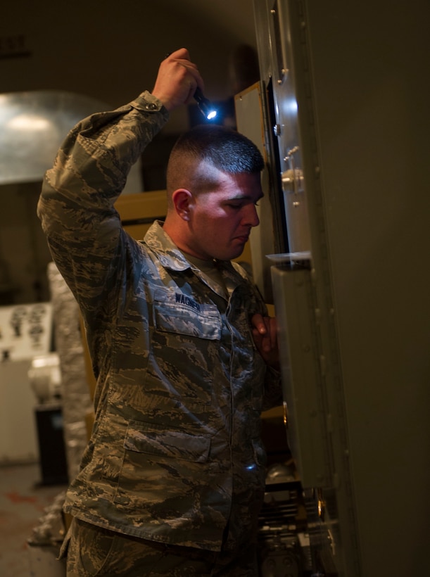 Senior Airman Kenneth Wagner, 91st Missile Maintenance Squadron facilities maintenance section technician, checks a panel outside of the launch control center at H-01 Missile Alert Facility in the missile complex, N.D., May 24, 2017. Airmen from the 91st MMXS teamed up with Airmen from the 5th Civil Engineer Squadron for “Blitzkrieg,” an operation where all the work orders that accrued during the winter months are completed. (U.S. Air Force photo/Senior Airman Apryl Hall)