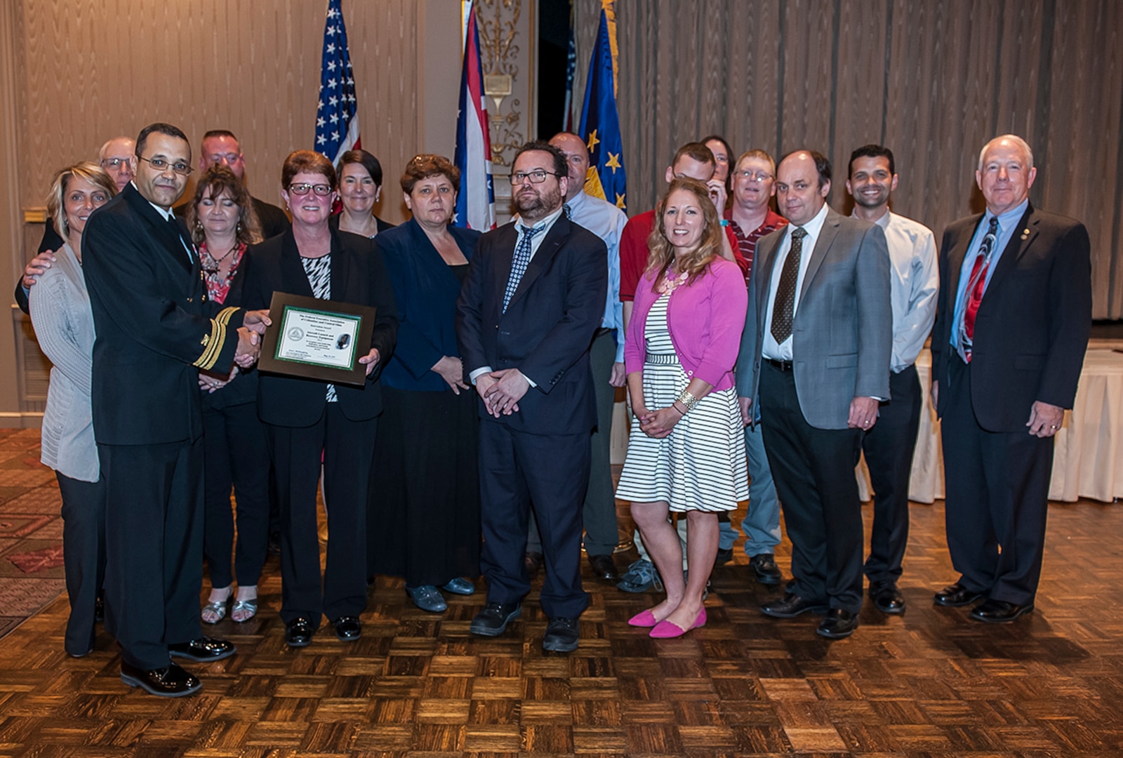 DLA Land and Maritime Deputy Commander and Federal Executive Association Chair James McClaugherty (right) presents the Team Innovation award to Land and Maritime’s Aircraft Launch and Recovery Equipment team during the May 24 FEA luncheon.