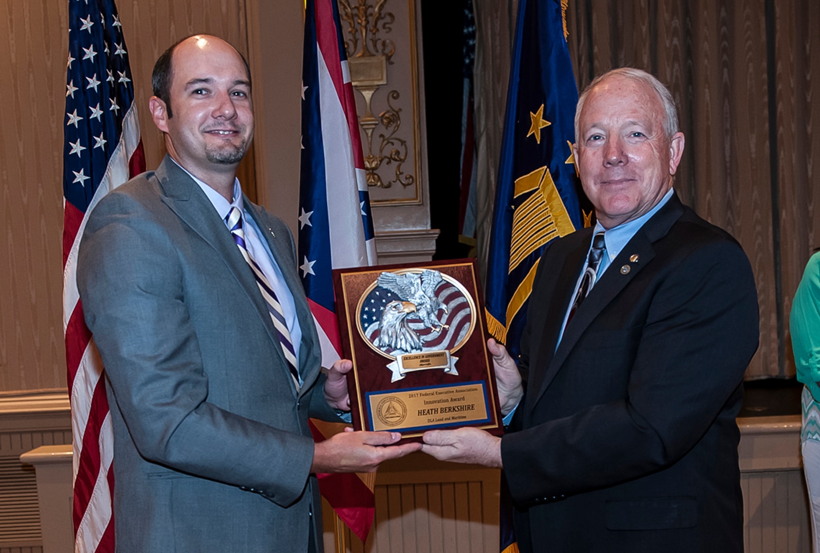 DLA Land and Maritime Deputy Commander and Federal Executive Association Chair James McClaugherty (right) presents Heath Berkshire with the Individual Innovation award for a large agency.