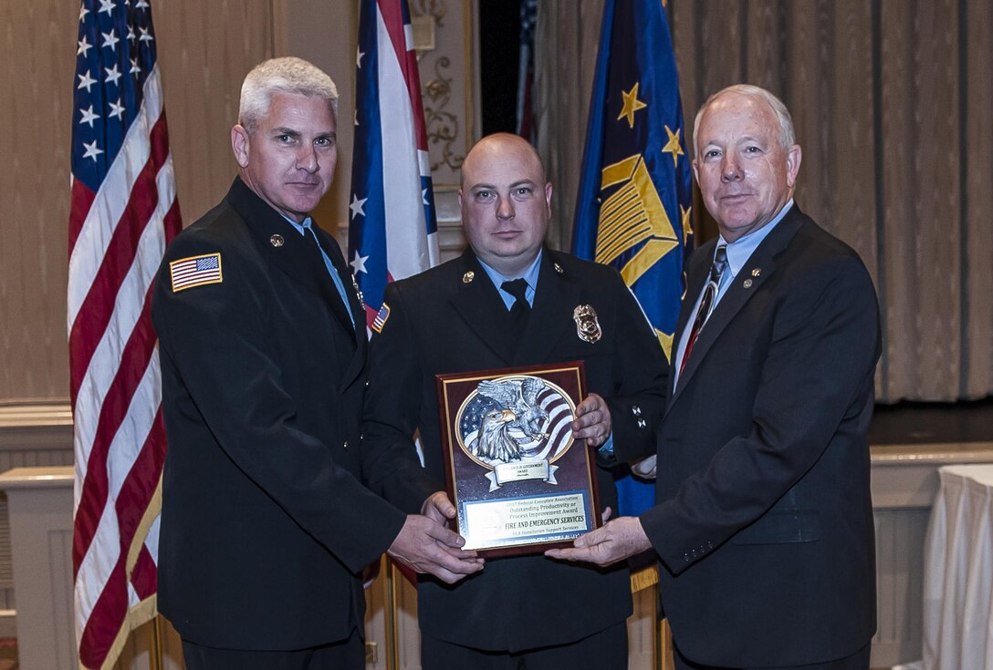 DLA Land and Maritime Deputy Commander and Federal Executive Association Chair James McClaugherty presents the Outstanding Productivity or Process Improvement award to the Fire and Emergency Services for a small agency.