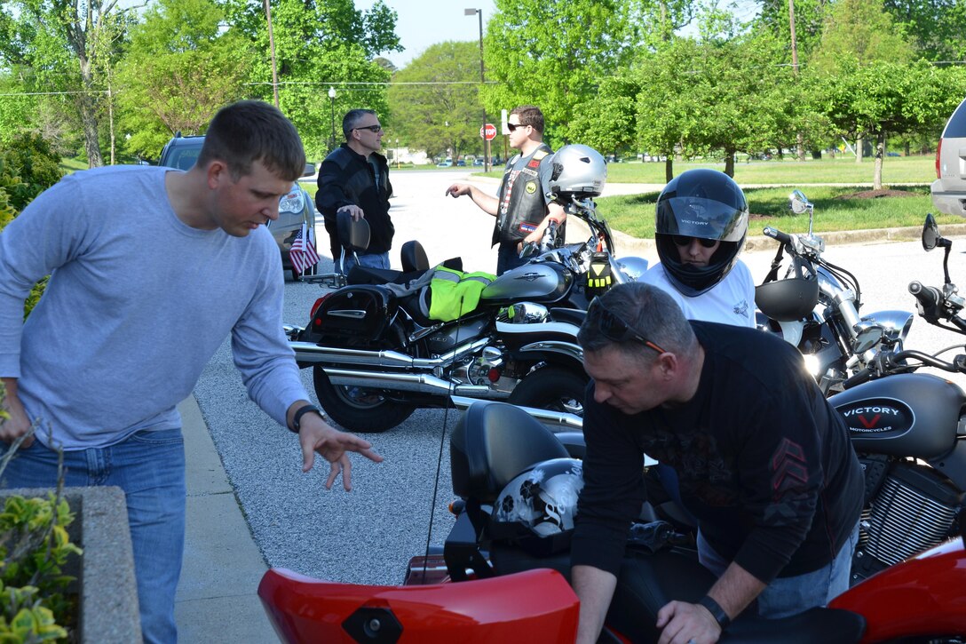 Army Staff Sgt. Joseph Reeves discusses motorcycle safety with Army Staff Sgt. David Meyer before they depart on the safety check ride April 28, 2017, at the Defense Information School. The safety check ride demonstrates the facility’s commitment to safety by ensuring riders wear all the proper gear while riding through the Fort Meade community.