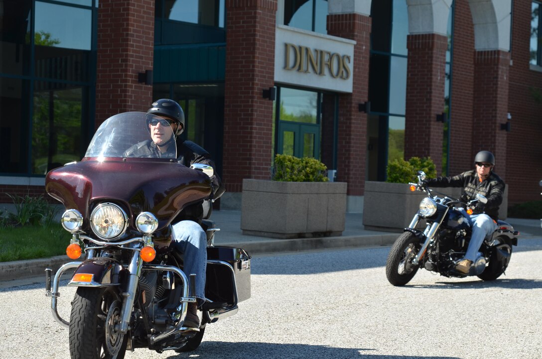 Army Col. Martin Downie and Air Force Lt. Col. Tony Wickman depart from the Defense Information School on the motorcycle safety check ride April 28, 2017. The safety check ride demonstrates the facility’s commitment to safety by ensuring riders wear all the proper gear while riding through the Fort Meade community. 