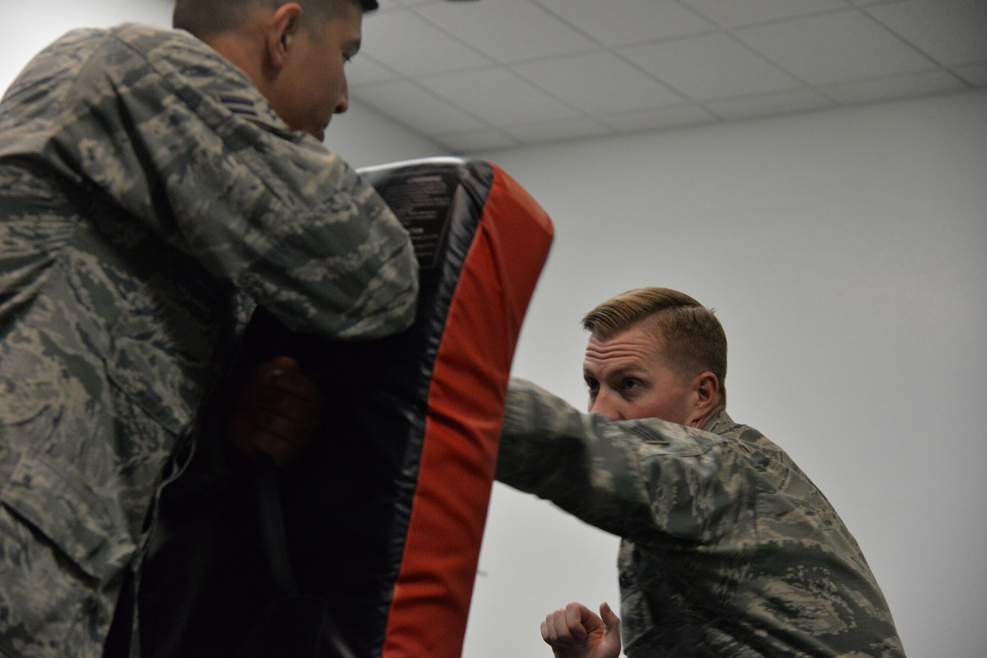 Staff Sgt. William Lamb, 741st Missile Security Forces Squadron tactical response force nuclear advance designated marksman program manager, right, practices combatives with Airman 1st Class Cristian Hernandez Mendoza, 341st MSFS response force leader, May 25, 2017, at Malmstrom Air Force Base, Mont. The Airmen are slated to leave for Joint Base McGuire-Dix-Lakehurst, N.J., in June for Phoenix Raven training. (U.S. Air Force photo/Airman 1st Class Daniel Brosam)