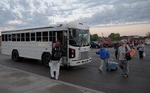 Minot Air Force Base Airmen board a bus at Minot Air Force Base N.D., May 25, 2017. Team Minot was victorious against Team Grand Forks, 16-10, in the 3rd annual North Dakota military softball tournament in Devil’s Lake, N.D. (U.S. Air Force photo/Airman 1st Class Dillon Audit)