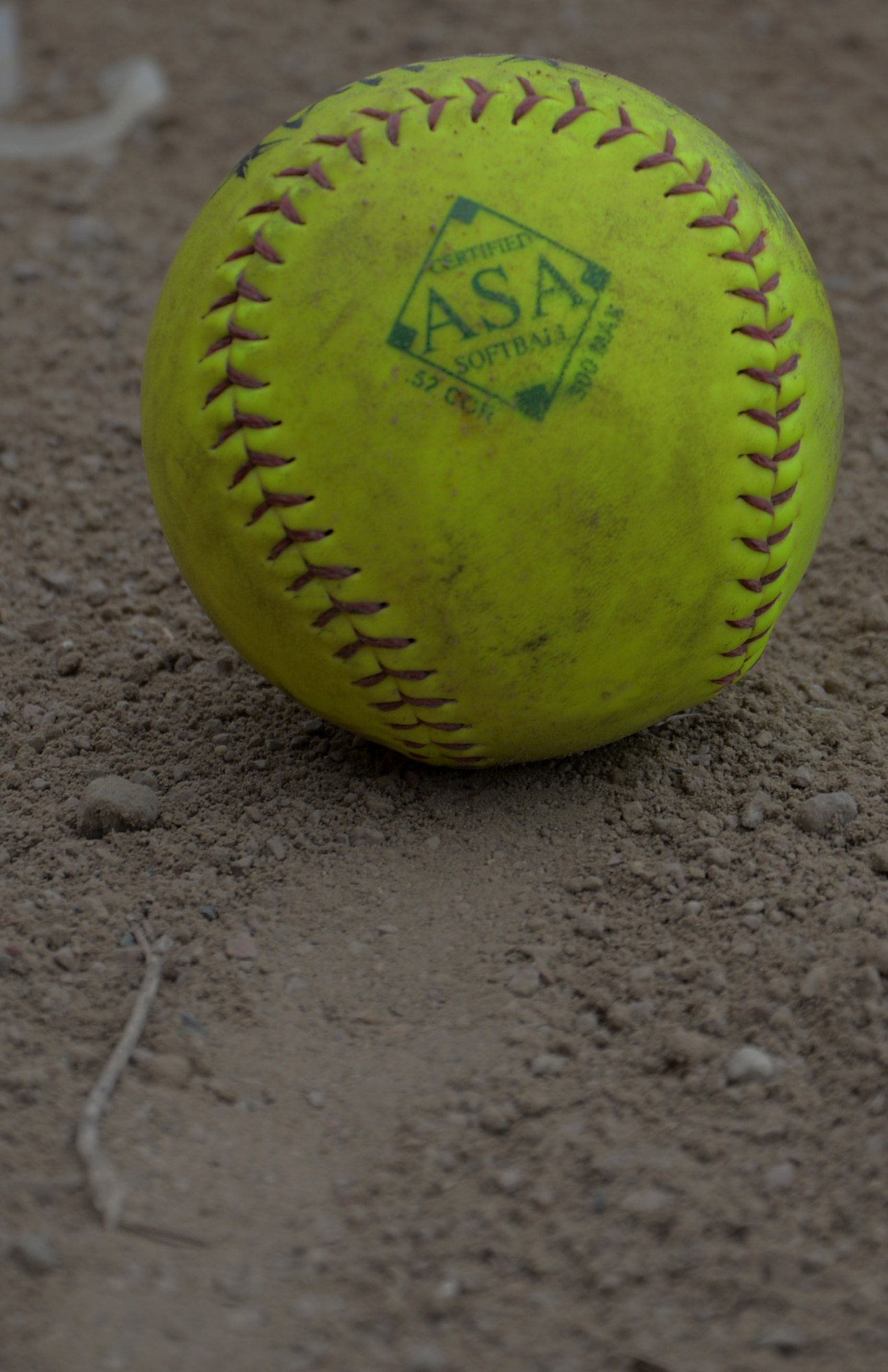 A softball lays in the dirt in a softball field in Devil lake N.D., May 25, 2017. Team Minot faced-off against Team Grand Forks and ended with a score of 16-10 in the 3rd annual North Dakota military softball tournament in Devil’s Lake, N.D. (U.S. Air Force photo/Airman 1st Class Dillon Audit)