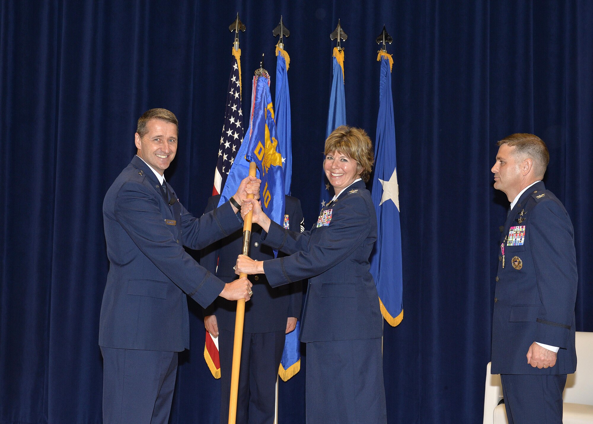 Col. Kerry R. Lovely (center), the incoming I.G. Brown Training and Education Center Commander, takes the detachment guidon from Brig. Gen. Steven S. Nordhaus, Air National Guard Readiness Center commander and ceremony officiator, during the change of command ceremony at McGhee Tyson Air National Guard Base, Tenn., June 1, 2017. During the ceremony Col. Kevin M. Donovan (right) relinquished command of TEC to Colonel Lovely, a former TEC Academy of Military Science graduate. (U.S. Air National Guard photo by Master Sgt. Jerry Harlan)