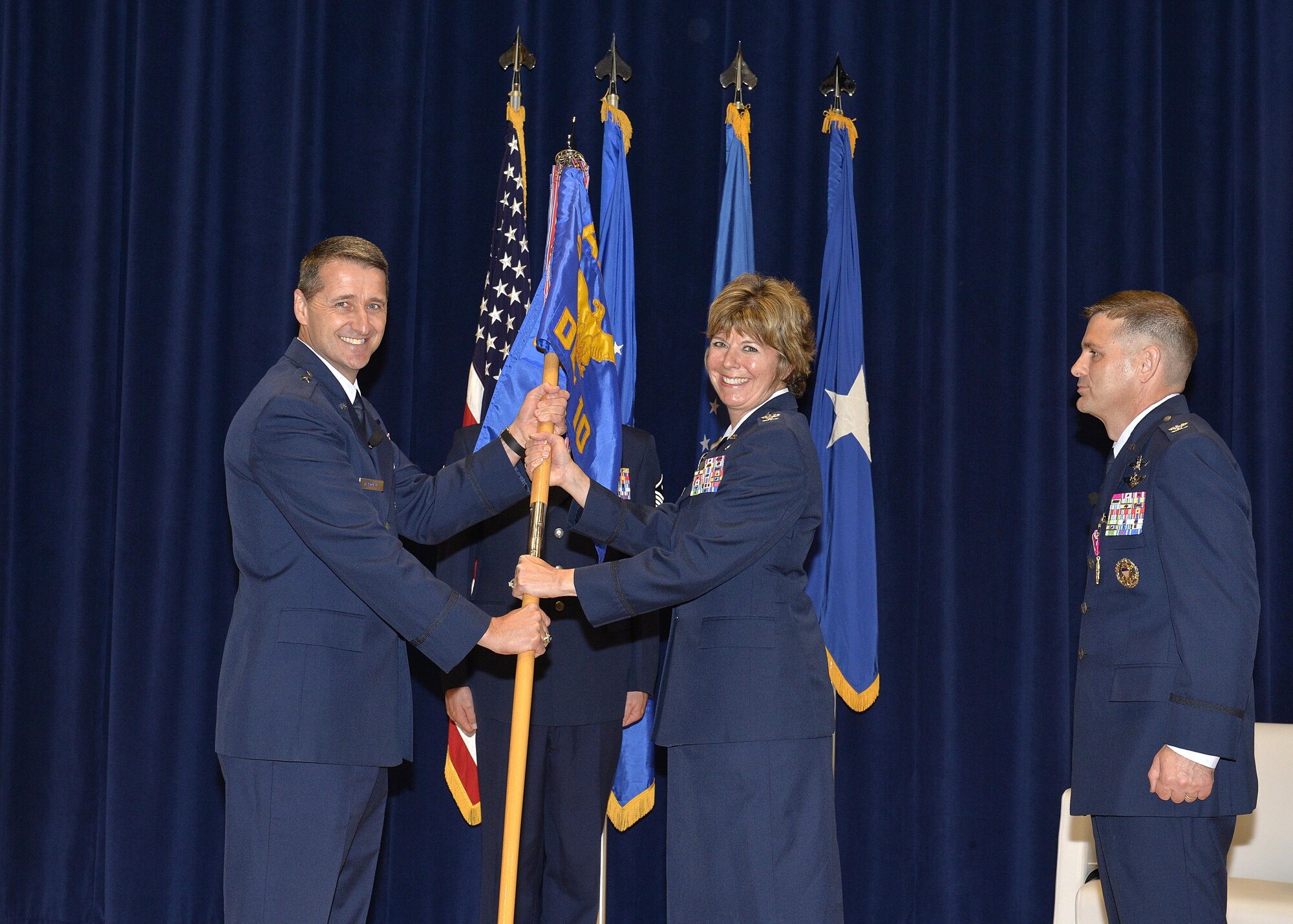 Col. Kerry R. Lovely (center), the incoming I.G. Brown Training and Education Center Commander, takes the detachment guidon from Brig. Gen. Steven S. Nordhaus, Air National Guard Readiness Center commander and ceremony officiator, during the change of command ceremony at McGhee Tyson Air National Guard Base, Tenn., June 1, 2017. During the ceremony Col. Kevin M. Donovan (right) relinquished command of TEC to Colonel Lovely, a former TEC Academy of Military Science graduate. (U.S. Air National Guard photo by Master Sgt. Jerry Harlan)