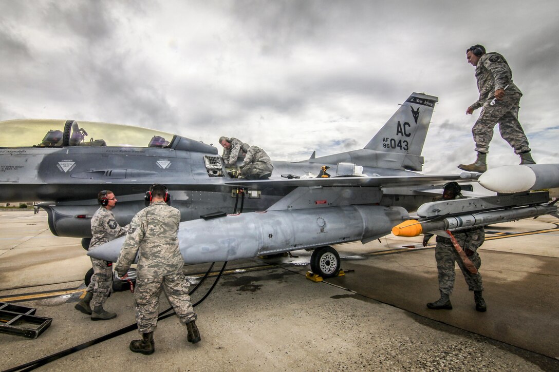 Maintenance airmen prepare an F-16D Fighting Falcon for a training mission during the 2017 CrossTell event, an air intercept exercise, at Atlantic City Air National Guard Base, N.J., May 24, 2017. The airmen are assigned to the New Jersey Air National Guard’s 177th Fighter Wing. Air National Guard photo by Master Sgt. Matt Hecht