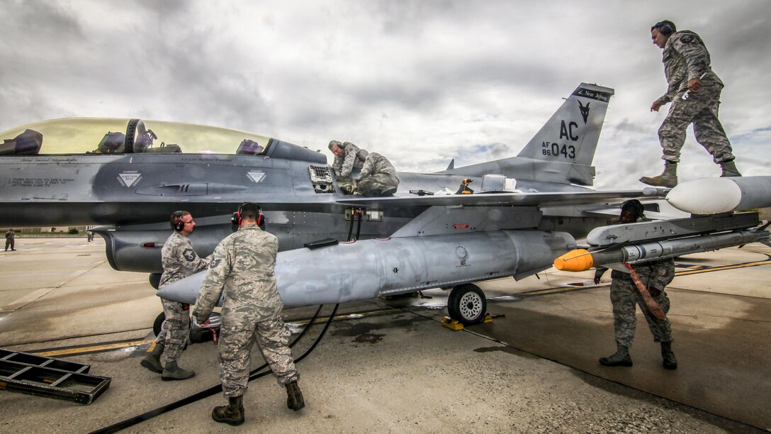 Maintenance airmen prepare an F-16D Fighting Falcon for a training mission during the 2017 CrossTell event, an air intercept exercise, at Atlantic City Air National Guard Base, N.J., May 24, 2017. The airmen are assigned to the New Jersey Air National Guard’s 177th Fighter Wing. Air National Guard photo by Master Sgt. Matt Hecht