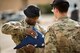 A member of the 27th Special Operations Security Forces Squadron folds an American flag during retreat at the 524th Special Operations Squadron end of mission ceremony at Cannon Air Force Base, N.M., May 31, 2017. The 524th is relocating to Duke Field, Florida, where the command will change hands from the 27th SOW to the 492nd SOW. The squadron has ties back to WWII, before it received its numerical designation of 524. (U.S. Air Force photo by Staff Sgt. Michael Washburn/Released)