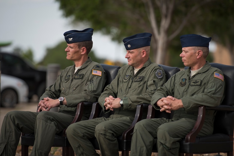 (Left) Col. Benjamin Maitre, 524th Special Operations Wing commander, (middle) Lt. Col. Derick Steed, 524th Special Operations Squadron commander, and Chief Master Sgt. Erik Thompson, 27 SOW command chief, sit during a 524 SOS end of mission ceremony at Cannon Air Force Base, N.M., May 31, 2017. The 524th is relocating to Duke Field, Florida, where the command will change hands from the 27th SOW to the 492nd SOW. The squadron has ties back to WWII, before it received its numerical designation of 524. (U.S. Air Force photo by Staff Sgt. Michael Washburn/Released)