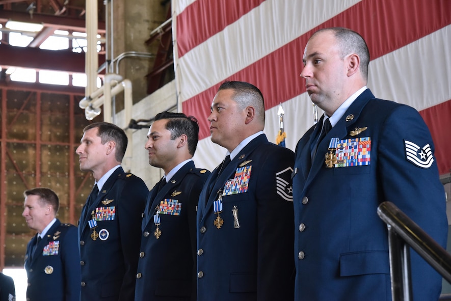 Commander of the 19th Air Force, Maj. Gen Patrick J. Doherty, (far left) presented four instructors from the 58th Special Operations Wing with Distinguished Flying Cross medals during a ceremony at Kirtland Air Force Base May 23. (Left to right) Maj. Robert Meyersohn, Maj. Arjun Rau, TSgt. David Shea and Tech. Sgt. Kenneth Zupow received the medals for their harrowing feats of bravery during separate missions in downrange environments. 