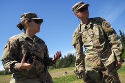 Army Sgt. Selena Sotelo, left, a native of Santa Maria, Calif., instructs Army Private Donaciano Prado, a native of Corpus Christi, Texas, on marksmanship techniques as Soldiers assigned to the 98th Support Maintenance Company, 17th Combat Sustainment Support Battalion, U.S. Army Alaska, conduct known distance marksmanship at Pedneau range on Joint Base Elmendorf-Richardson, Alaska, May 31, 2017.  The SMC is a modular maintenance company that provides field maintenance support on an area basis to units in the form of allied trades support; wheeled vehicle recovery; armament; communications; electronics; special electronic devices; ground support equipment; power generation equipment; utility equipment; and test, measurement, and diagnostic equipment maintenance and quality control.