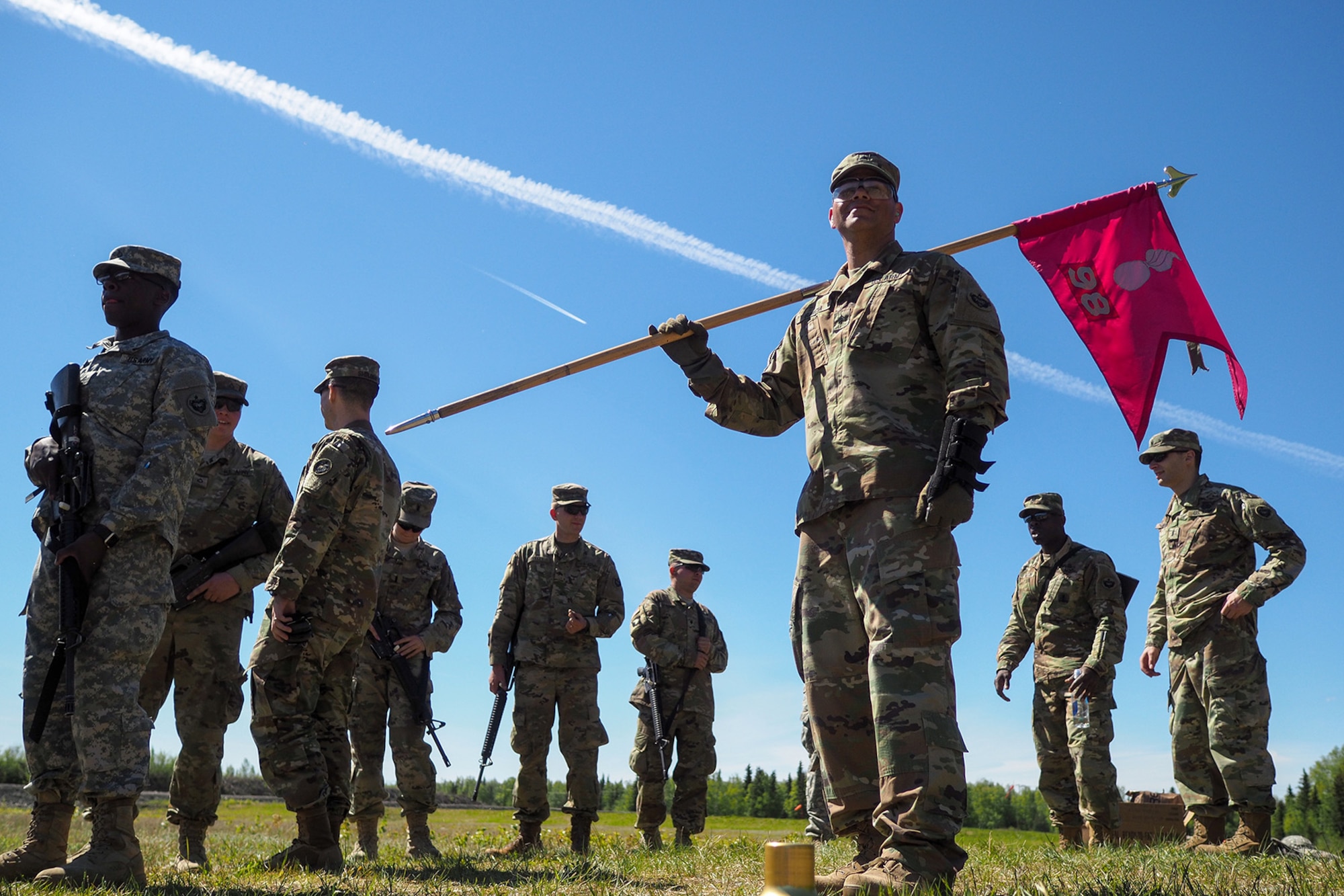 Army Sgt. Michael Garcia, a native of Yabucoa, P.R., holds his company guidon as Soldiers assigned to the 98th Support Maintenance Company, 17th Combat Sustainment Support Battalion, U.S. Army Alaska, to conduct known distance marksmanship at Pedneau range on Joint Base Elmendorf-Richardson, Alaska, May 31, 2017.  The SMC is a modular maintenance company that provides field maintenance support on an area basis to units in the form of allied trades support; wheeled vehicle recovery; armament; communications; electronics; special electronic devices; ground support equipment; power generation equipment; utility equipment; and test, measurement, and diagnostic equipment maintenance and quality control.