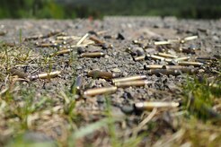 Expended 5.56mm casings are seen on the ground as Soldiers assigned to the 98th Support Maintenance Company, 17th Combat Sustainment Support Battalion, U.S. Army Alaska, conduct known distance marksmanship at Pedneau range on Joint Base Elmendorf-Richardson, Alaska, May 31, 2017.  The SMC is a modular maintenance company that provides field maintenance support on an area basis to units in the form of allied trades support; wheeled vehicle recovery; armament; communications; electronics; special electronic devices; ground support equipment; power generation equipment; utility equipment; and test, measurement, and diagnostic equipment maintenance and quality control.