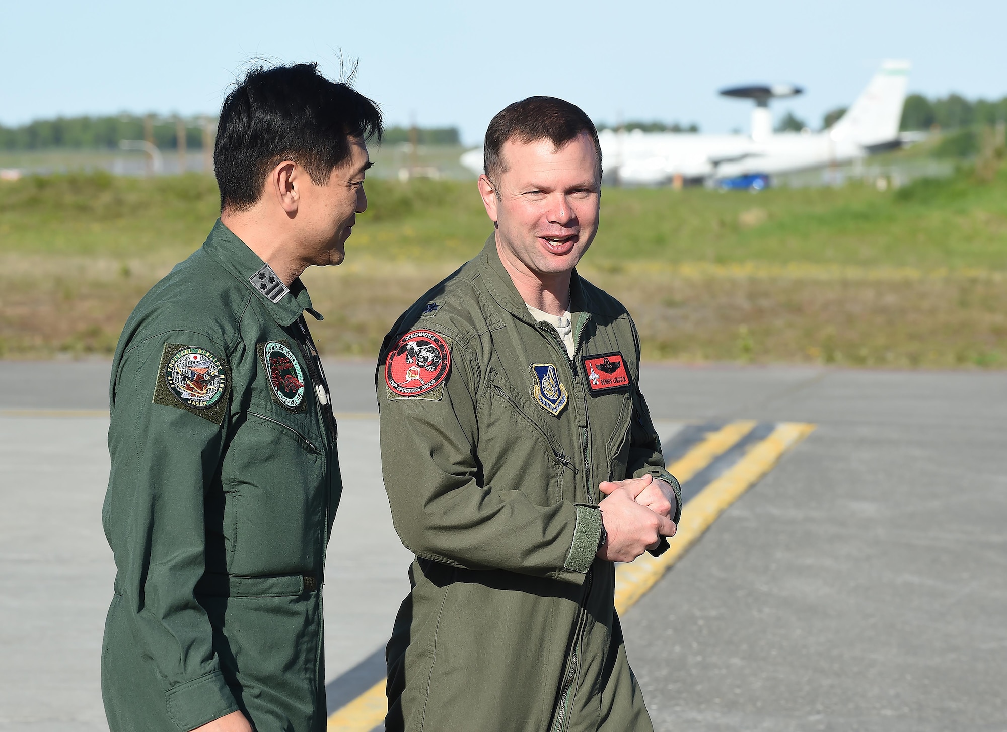 Japanese Air Self-Defense Force Col. Masashi Ota is greeted by U.S. Air Force Lt. Col. Dennis Lincoln after arriving at Joint Base Elmendorf-Richardson, Alaska, June 1, 2017. Ota and his team are participating in a joint exercise. 