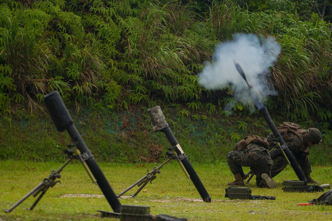A mortar team with Weapons Company, Battalion Landing Team, 3rd Battalion, 5th Marines, fires an 81 mm mortar during training at Camp Hansen, Okinawa, Japan, May 31, 2017. BLT 3/5 is currently deployed as the Ground Combat Element of the 31st Marine Expeditionary Unit. Weapons Company is the heavy-weapons element of BLT 3/5. Their arsenal includes heavy machine guns, mortars and anti-tank weapons. (Official U.S. Marine Corps photo by Staff Sgt. T. T. Parish/Released)
