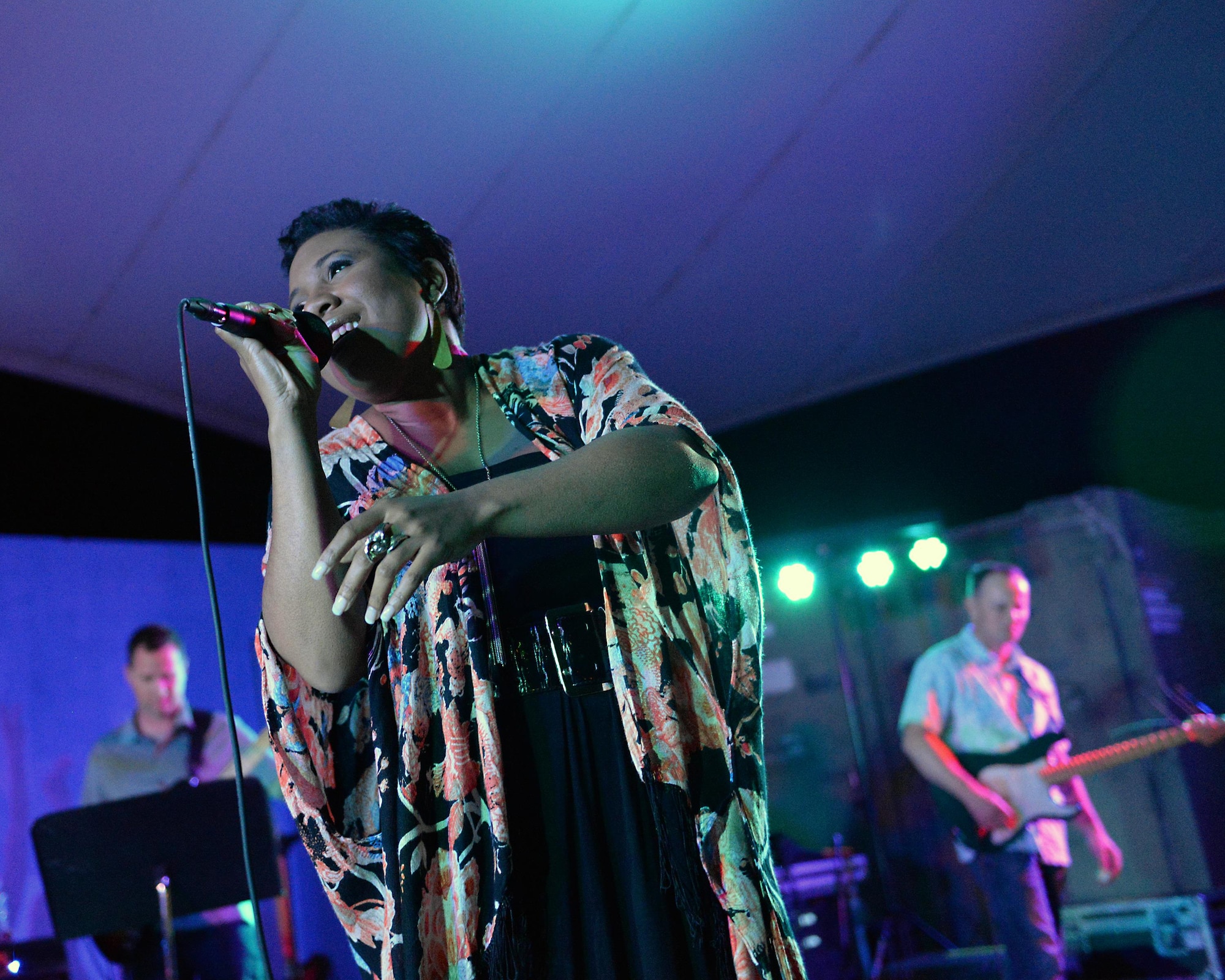 Melinda Doolittle, an accomplished vocalist and top finisher on American Idol, holds a concert with music and backup singing from members of the Air Forces Central Command Band at Al Udeid Air Base, Qatar, May 25, 2017. Doolittle performed for service members deployed overseas, accompanied by the Air Forces Central Command Band. (U.S. Air Force photo by Tech. Sgt. Bradly A. Schneider/Released)