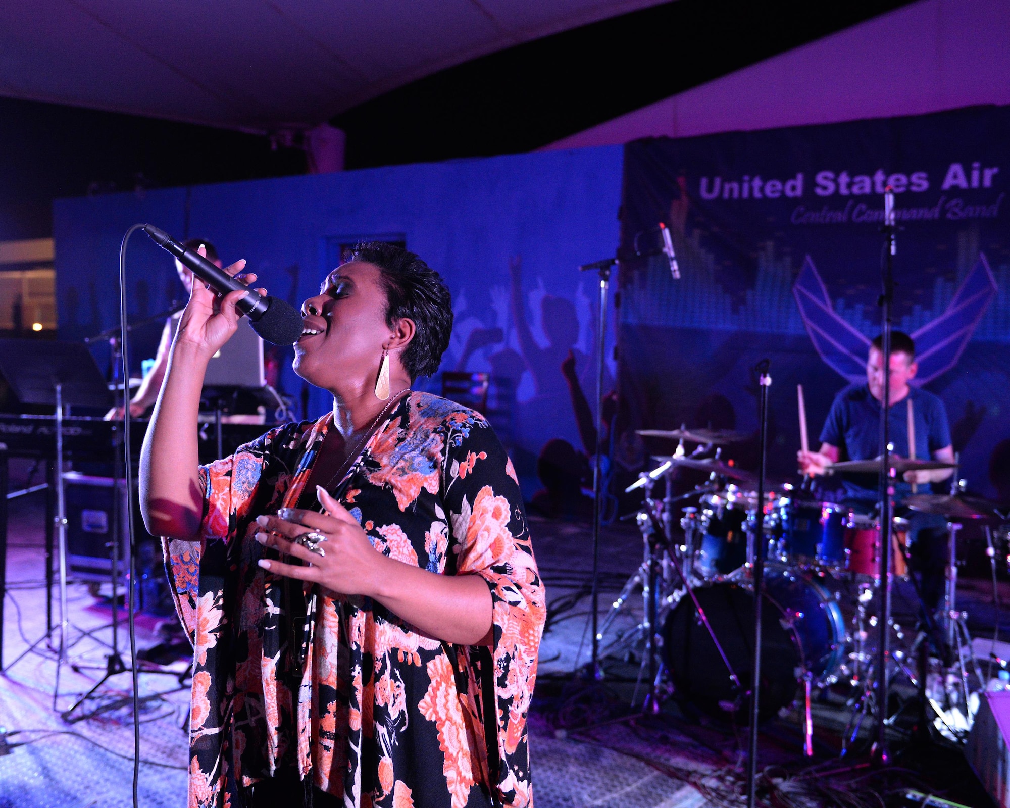 Melinda Doolittle, an accomplished vocalist and top finisher on American Idol, holds a concert with music and backup singing from members of the Air Forces Central Command Band at Al Udeid Air Base, Qatar, May 25, 2017. Doolittle performed for service members deployed overseas, accompanied by the Air Forces Central Command Band. (U.S. Air Force photo by Tech. Sgt. Bradly A. Schneider/Released)