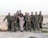 Members of the Air Forces Central Command Band pose for a photograph with Melinda Doolittle, an accomplished vocalist and top finisher on American Idol, following a practice session held at an outside venue in preparation for a concert at Al Udeid Air Base, Qatar, May 25, 2017. Doolittle performed for service members deployed overseas, accompanied by the Air Forces Central Command Band. (U.S. Air Force photo by Tech. Sgt. Bradly A. Schneider/Released)