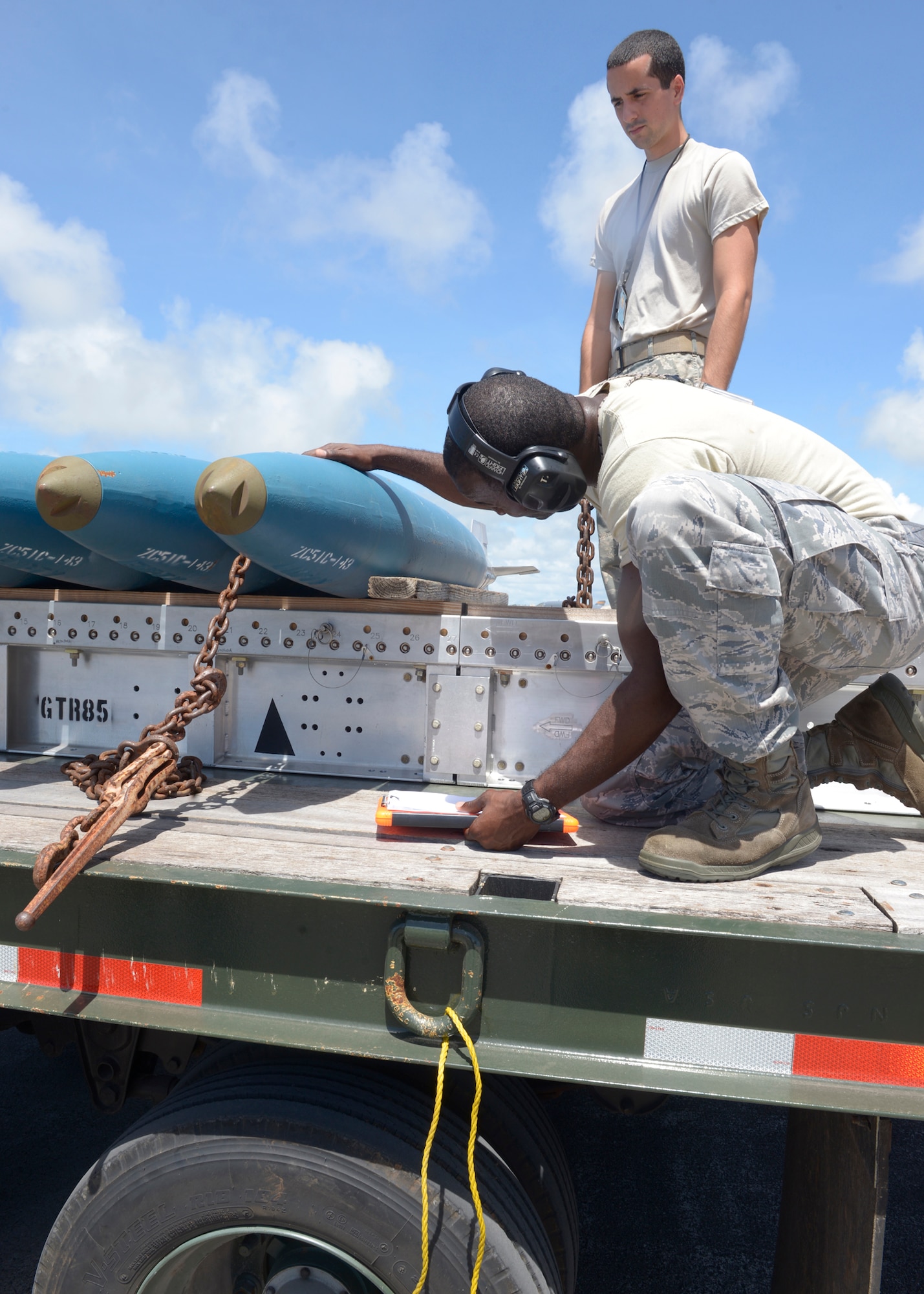 Tech. Sgt. Tyrone Garner, 36th Expeditionary Maintenance Squadron weapons expediter, checks out a Bomb Disposal Unit 50, before instructing his team to load them onto a B-1 Lancer May, 30, 2017 at Andersen Air Force Base, Guam. Depending on the mission of the Lancer, the crew may load Joint Direct Attack Munitions, Joint Air-to-Surface Standoff Missiles or when practicing, Bomb Disposal Units 50 and 56. (U.S. Air Force photo by Senior Airman Cierra Presentado/Released)