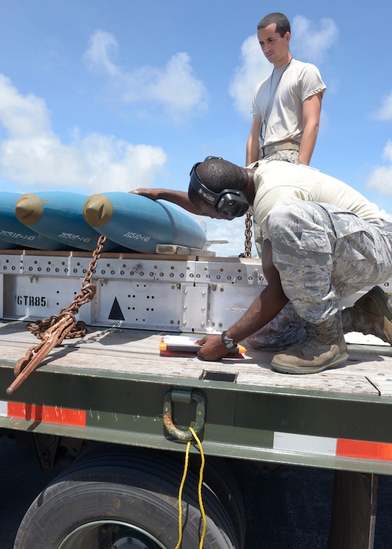 Tech. Sgt. Tyrone Garner, 36th Expeditionary Maintenance Squadron weapons expediter, checks out a Bomb Disposal Unit 50, before instructing his team to load them onto a B-1 Lancer May, 30, 2017 at Andersen Air Force Base, Guam. Depending on the mission of the Lancer, the crew may load Joint Direct Attack Munitions, Joint Air-to-Surface Standoff Missiles or when practicing, Bomb Disposal Units 50 and 56. (U.S. Air Force photo by Senior Airman Cierra Presentado/Released)