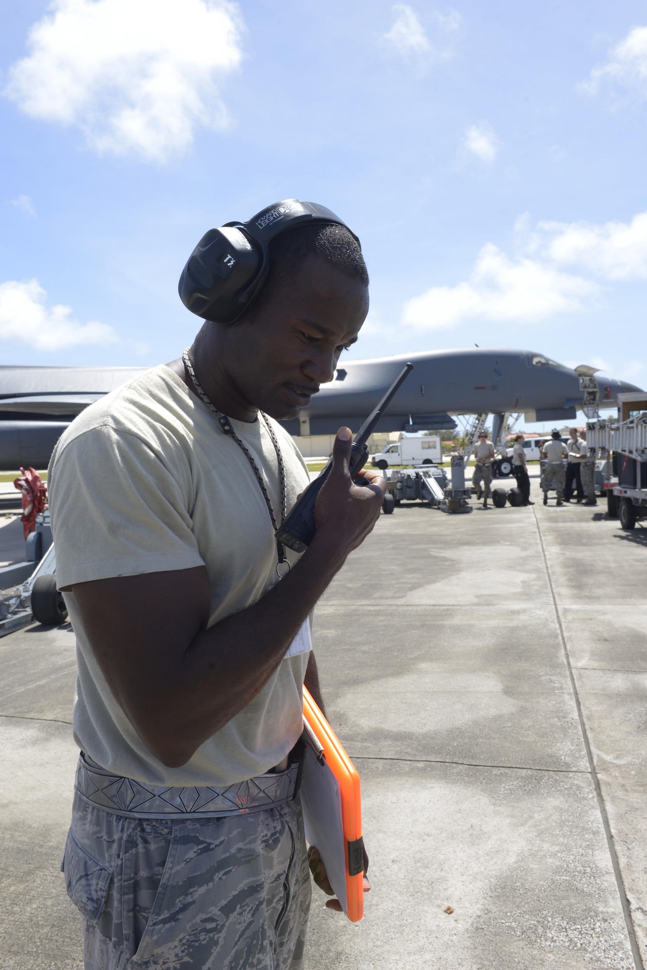 Tech. Sgt. Tyrone Garner, 36th Expeditionary Aircraft Maintenance Squadron weapons expediter, gives commands via radio to his weapons loading team May, 30, 2017, at Andersen Air Force Base, Guam. Garner and his team are deployed here from Dyess AFB, TX, in support of Pacific Command’s Continuous Bomber Presence mission. (U.S. Air Force Photo by Senior Airman Cierra Presentado/Released)