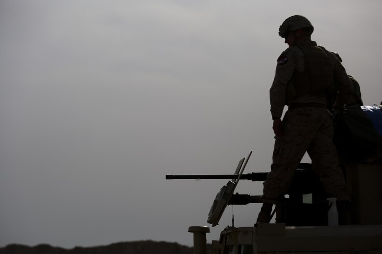 U.S. Marine Corps Capt. Zachary Weidner, the Iraqi Security Force Development Officer of Task Force Al-Taqaddum, deployed in support of Combined Joint Task Force – Operation Inherent Resolve, watches as an Iraqi soldier with 1st Company, 2nd Battalion, 40th Brigade, 10th Iraqi Army Division, fire a .50-caliber machine gun while training in Iraq, April 12, 2017. This training provided the Iraqi soldiers an opportunity to hone their skills with large weapons systems. This training is part of the overall CJTF-OIR building partner capacity mission by training and improving the capability of partnered forces fighting ISIS. CJTF-OIR is the global Coalition to defeat ISIS in Iraq and Syria. (U.S. Marine Corps photo by Cpl. Shellie Hall)