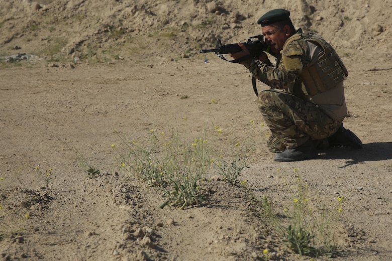 An Iraqi soldier with 2nd Battalion, Commando Brigade, Anbar Operations Command, provides notional security while conducting maneuver under fire drills with Task Force Al-Taqaddum, Combined Joint Task Force – Operation Inherent Resolve, in Iraq, April 17, 2017. This training is part of the overall CJTF-OIR building partner capacity mission by training and improving the capability of partnered forces fighting ISIS. CJTF-OIR is the global Coalition to defeat ISIS in Iraq and Syria. (U.S. Marine Corps photo by Cpl. Shellie Hall)
