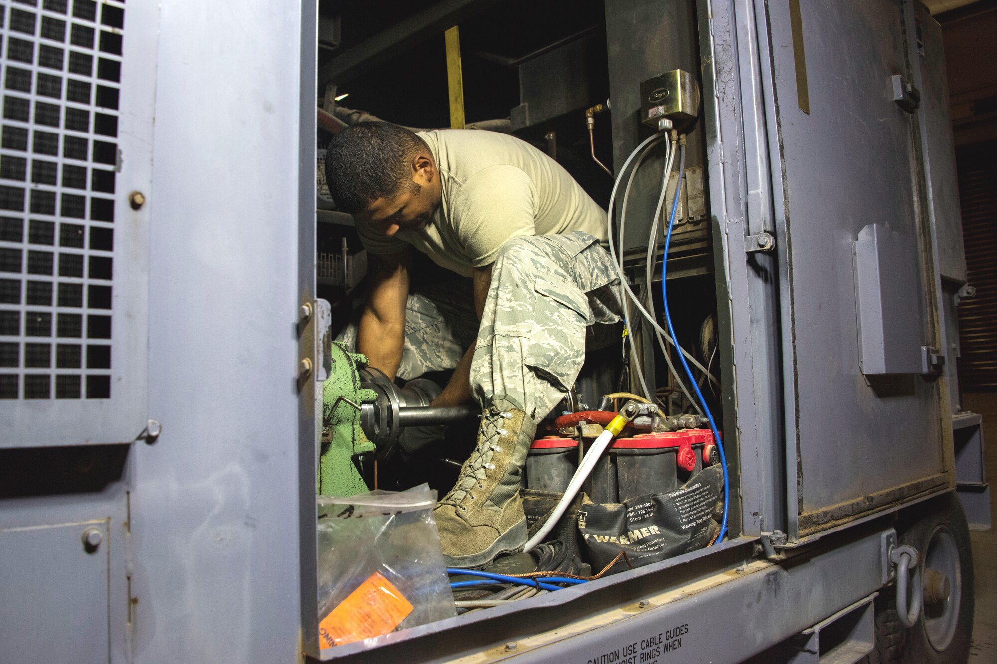 Staff Sgt. Carlos Hernandez-Garcia, a 386th Expeditionary Aircraft Maintenance Squadron aerospace ground equipment craftsman, installs a compressor driveshaft and clutch on a MA-3D air conditioning unit at an undisclosed location in Southwest Asia, May 7, 2017. The 15-member flight maintains and repairs more than 130 pieces of aerospace ground equipment to fit the demands of the airpower mission, including generators, air conditioners, hydraulic test stands nitrogen servicing carts. (U.S. Air Force photo/Tech. Sgt. Jonathan Hehnly) 