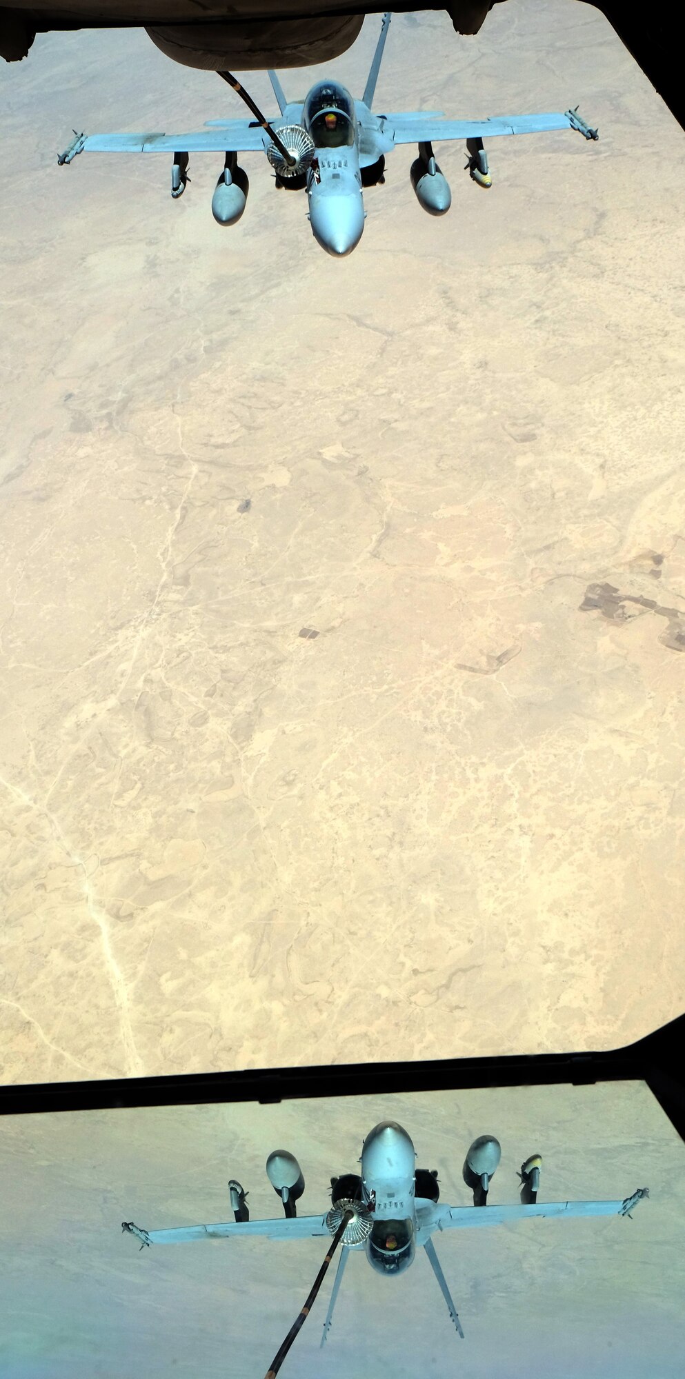 A U.S. Marine F-18 Super Hornet receives fuel from a 908th Expeditionary Air Refueling Squadron KC-10 Extender May 31, 2017, over an undisclosed location in southwest Asia. The Super Hornet is highly capable across the full mission spectrum, enabling air superiority through fighter escort, reconnaissance, close air support, air defense suppression and day or night precision strikes. (U.S. Air Force photo by Senior Airman Preston Webb)