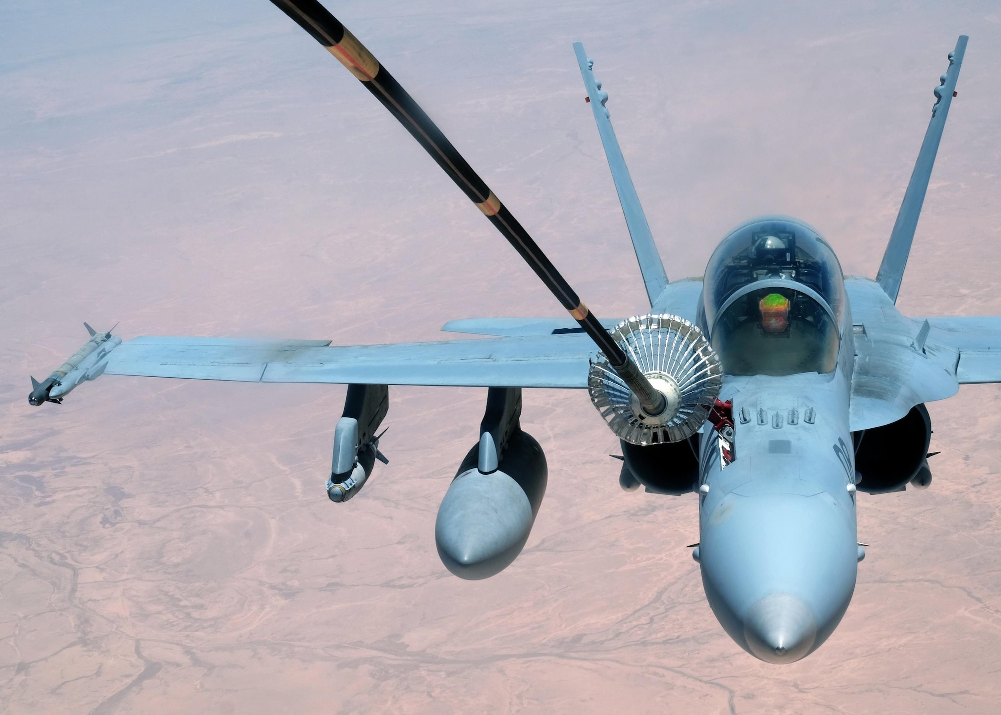 A U.S. Marine F-18 Super Hornet receives fuel from a 908th Expeditionary Air Refueling Squadron KC-10 Extender May 31, 2017, over an undisclosed location in southwest Asia. The Super Hornet is highly capable across the full mission spectrum, enabling air superiority through fighter escort, reconnaissance, close air support, air defense suppression and day or night precision strikes. (U.S. Air Force photo by Senior Airman Preston Webb)
