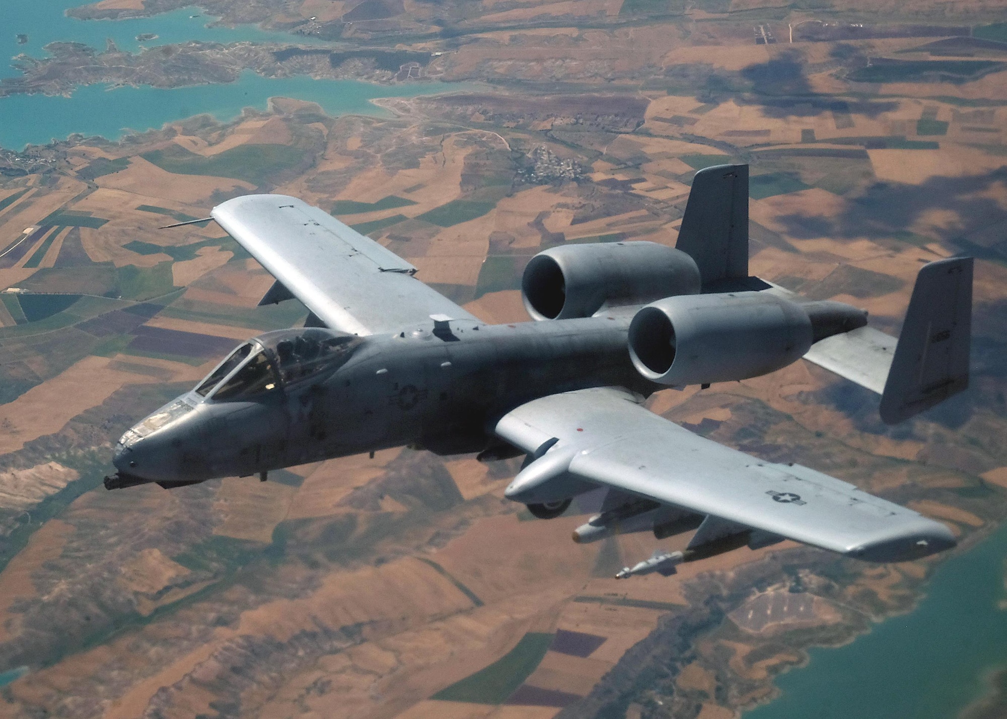 An A-10 Thunderbolt II flies over an undisclosed location May 31, 2017, in southwest Asia. The Thunderbolt II can employ a wide variety of conventional munitions and the GAU-8/A 30mm cannon, capable of firing 3,900 rounds per minute to defeat a wide variety of targets including tanks. (U.S. Air Force photo by Senior Airman Preston Webb)