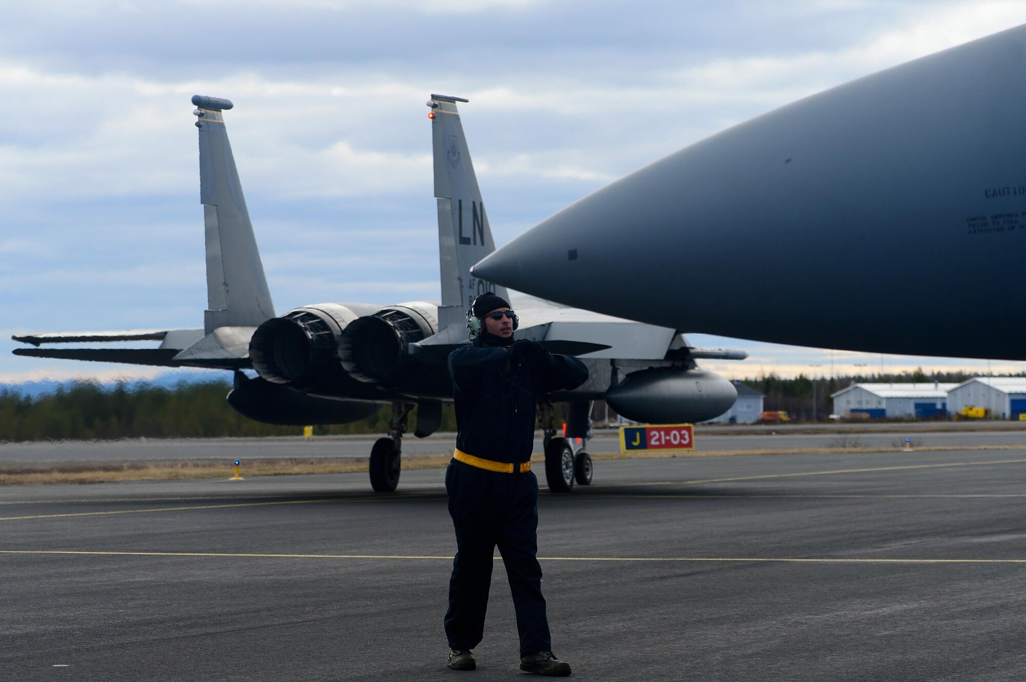A 493rd Aircraft Maintenance Unit crew chief from Royal Air Force Lakenheath, England, guides an F-15C Eagle onto the taxiway at Rovaniemi Air Base, Finland, May 26, in support of Arctic Challenge 2017. Through exercises like ACE 17, the U.S., allies and partner nations are able to train together in a realistic environment, working to ensure security, protect global interests and strengthen economic bonds in Europe. (U.S. Air Force photo/Airman 1st Class Abby L. Finkel)