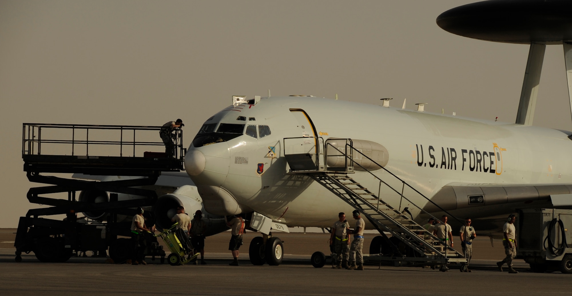 Airmen with the 380th Expeditionary Aircraft Maintenance Squadron E-3 Sentry Aircraft Maintenance Unit recover an E-3 Sentry after a flight May 25, 2017, at an undisclosed location in southwest Asia. To prepare the aircraft to fly again not only do AMU Airmen perform day-to-day maintenance, but also specialize in a wide variety of systems such as radio, navigation, radar, coolant, and computer systems. (U.S. Air Force photo by Senior Airman Preston Webb)