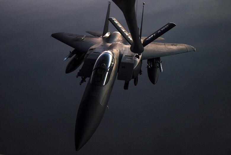 An F-15E Strike Eagle arrives to receive fuel from a 340th Expeditionary Air Refueling Squadron KC-135 Stratotanker during a flight in support of Operation Inherent Resolve May 23, 2017. The KC-135 provides aerial refueling capabilities as it supports U.S. and coalition forces working to liberate territory and people under the control of Islamic State of Iraq and Syria. (U.S. Air Force photo/Staff Sgt. Trevor T. McBride)