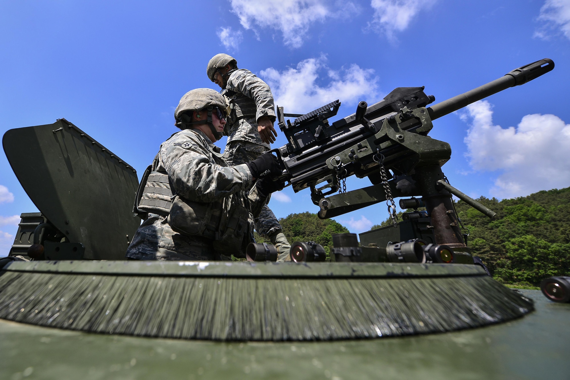 Airman Destri Snow, a 51st Security Forces Squadron defender, fires an MK-19 grenade launcher during  weapons qualification training at Camp Rodriguez, South Korea, May 24, 2017. The training ensures defenders are vigilant and mission ready. (U.S. Air Force photo/Airman 1st Class Gwendalyn Smith)