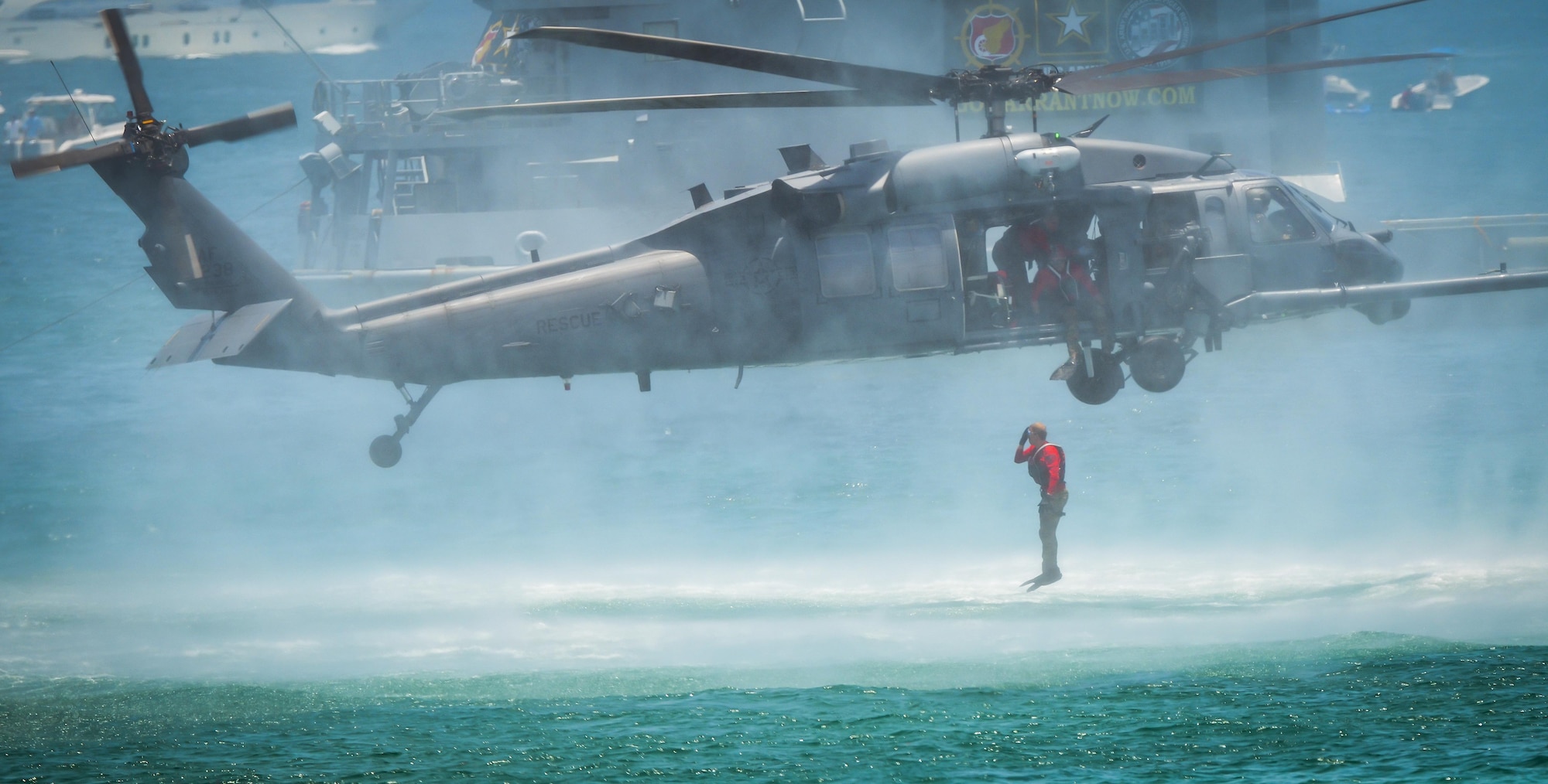 A pararescueman assigned to the 920th Rescue Wing, Patrick Air Force Base, Fla., enters the water from an HH-60G Pave Hawk helicopter during the National Salute to America’s Heroes Air and Sea Show, May 27, 2017, at Miami Beach, Fla. Top tier U.S. military assets assembled in Miami during Memorial Day weekend to showcase air superiority while honoring those who have made the ultimate sacrifice. The 920th Rescue Wing, the Air Force Reserve’s only rescue wing, headlined the airshow, demonstrating combat-search-and-rescue capabilities by teaming up with a HC-130P/N Combat King and four A-10 Thunderbolt II aircraft. (U.S. Air Force photo/Senior Airman Brandon Kalloo Sanes)