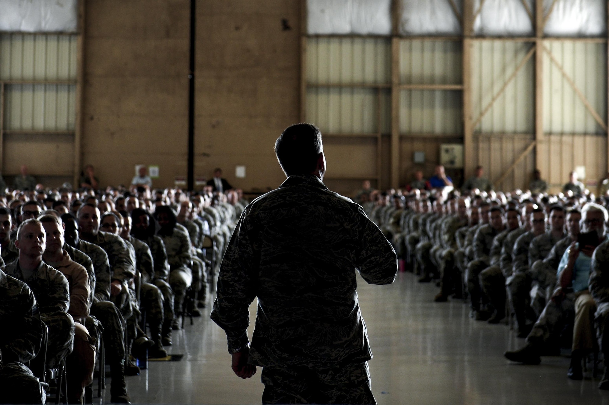 Airmen listen as Air Force Chief of Staff Gen. David L. Goldfein speaks about current Air Force operations during an all-call at Shaw Air Force Base, May 30, 2017. During the all-call Airmen asked Goldfein questions about the current state of the Air Force and the direction the service is headed. (U.S. Air Force photo/Airman 1st Class Christopher Maldonado)