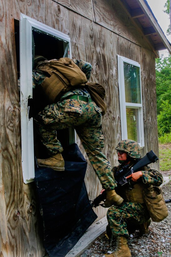 Marines breach a window during training at Camp Lejeune, N.C., May 24, 2017. Marine Corps photo by Lance Cpl. Leynard Kyle Plazo