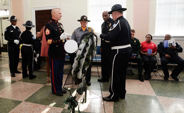 Marine Corps Logistics Base Albany’s Marine Corps Police Department law enforcement personnel join fellow uniformed officers from Albany and Dougherty County Police Departments, Dougherty County Sheriff’s Department to participate in the city’s Law Enforcement Memorial Week Ceremony, recently. A capacity crowd of law enforcement officers, family members and local government officials attended the ceremony, which was held at Albany State University’s L. Orene Hall, is an annual observance to commemorate the sacrifices of police officers who died in the line of duty.