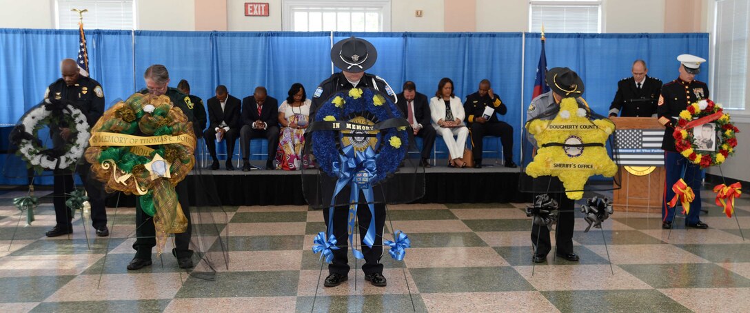 Marine Corps Logistics Base Albany’s Marine Corps Police Department law enforcement personnel join fellow uniformed officers from Albany and Dougherty County Police Departments, Dougherty County Sheriff’s Department to participate in the city’s Law Enforcement Memorial Week Ceremony, recently. A capacity crowd of law enforcement officers, family members and local government officials attended the ceremony, which was held at Albany State University’s L. Orene Hall, is an annual observance to commemorate the sacrifices of police officers who died in the line of duty.