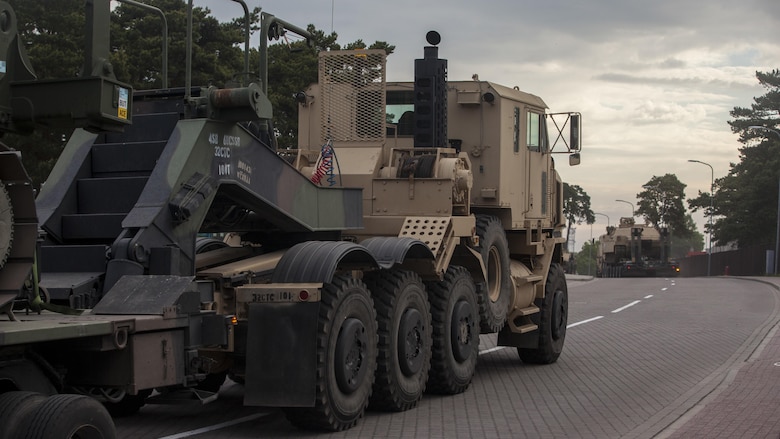 VENTSPILS, Latvia- NATO nations participate in convoy operations alongside Marines while escorted by Latvian Movement and Control officers during exercise Saber Strike 17 in Ventspils, Latvia, May 28, 2017. Exercise Saber Strike 17 is an annual combined-joint exercise conducted at various locations throughout the Baltic region and Poland. The combined training prepares allies and partners to respond more to regional crises and meet their own security needs by improving the security of borders and countering threats. 