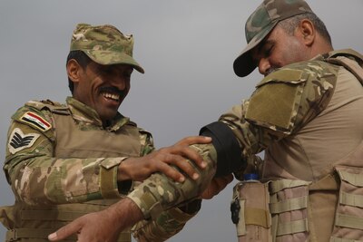 Iraqi soldiers with 2nd Battalion, Commando Brigade, Anbar Operations Command, apply tourniquets during a combat lifesaver course with Task Force Al-Taqaddum, Combined Joint Task Force – Operation Inherent Resolve, in Iraq, April 17, 2017. This training is part of the overall CJTF-OIR building partner capacity mission by training and improving the capability of partnered forces fighting ISIS. CJTF-OIR is the global Coalition to defeat ISIS in Iraq and Syria.  (U.S. Marine Corps photo by Cpl. Shellie Hall)